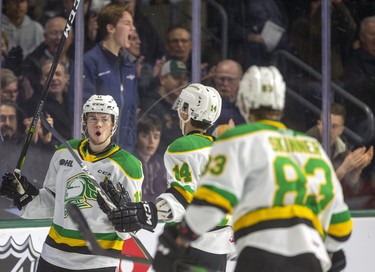 London Knights scorer Connor McMichael celebrates his goal against the Windsor Spitfires with teammates Luke Evangelista and Hunter Skinner during the first period of their OHL game Friday night at Budweiser Gardens in London. Photograph taken on Friday November 29, 2019. 
Mike Hensen/The London Free Press/Postmedia Network