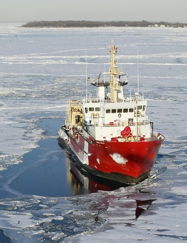 Plane crash investigators aboard the Canadian Coast Guard vessel Samual Risley conduct their search using a remote-operated vehicle into Lake Erie near the submerged wreckage of Cessna Caravan which crashed west of Pelee Island (shown in background) on January 17, 2004, killing ten people.  (The Windsor Star - NICK BRANCACCIO)