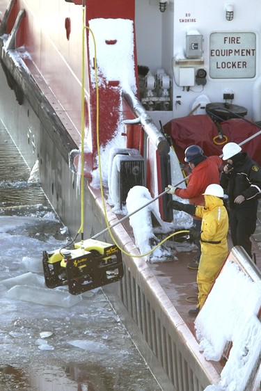 Plane crash investigators aboard the Canadian Coast Guard vessel Samuel Risley lower a remote-operated vehicle into Lake Erie near the submerged wreckage of Cessna Caravan which crashed west of Pelee Island on January 17, 2004 killing ten people.  (The Windsor Star - NICK BRANCACCIO)