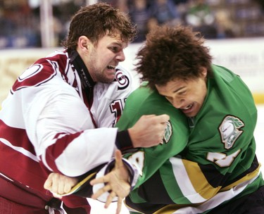 Matt Kennedy of the Guelph Storm lands a shot during a fight with Akim Aliu of the London Knights in the first period of their OHL playoff game last night at the John Labatt Centre. Aliu got the worst of it in terms of penalty minutes - 17 to only five for Kennedy - and the Storm went on to get the best of the Knights in a 5-0 win, taking the best-of-seven Western Conference quarter-final in five games.