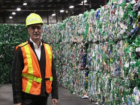 ReVital Polymers chief commercial officer Keith Bechard stands at the Sarnia recycling facility with bales of plastic he says would have gone to China if the country didn't enact restrictions in 2018. Bechard and others said China's ban has been the kick needed to create more domestic recycling infrastracture. (Tyler Kula/Postmedia Network)