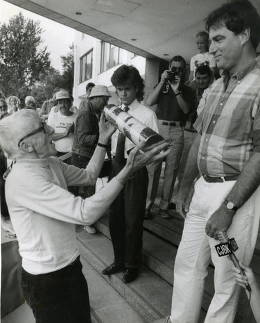 London historian Rev. Orlo Miller presents the Talbot streetscape time capsule to mayor Tom Gosnell calling it a 'petition for the salvation' of the 19th century block, 1988.  (London Free Press files)