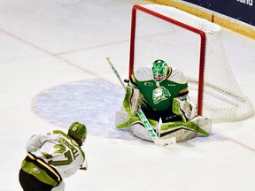 Mitchell Russell of the North Bay Battalion catches the far side behind goaltender Dylan Myskiw of the London Knights in the second period of their Ontario Hockey League game Thursday night at Memorial Gardens. North Bay won, 7-4. (Sean Ryan photo)