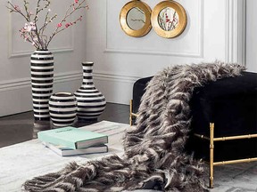 Keeping my toes toasty and my rooms stylish this winter is easy with a cozy, stylish faux fur throw.