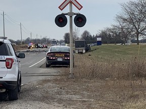 Provincial police secure the scene of a deadly SUV-transport crash on Talbot Line north of St. Thomas Friday. SUV driver Timothy Regnier, 36, of London, died at the scene, Elgin OPP said. 
(Laura Broadley/Postmedia News)