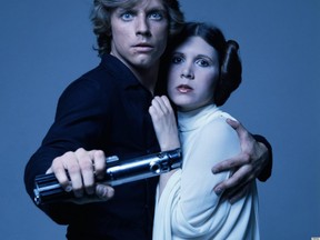 Actors Mark Hamill and Carrie Fisher in costume as brother and sister Luke Skywalker and Princess Leia in George Lucas' Star Wars trilogy, 1977. (Getty Images)