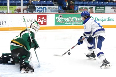 Chase Stillman, right, of the Sudbury Wolves, attempts to shot the puck past Brett Brochu, of the London Knights, during OHL action at the Sudbury Community Arena in Sudbury, Ont. on Friday December 20, 2019. John Lappa/Sudbury Star/Postmedia Network