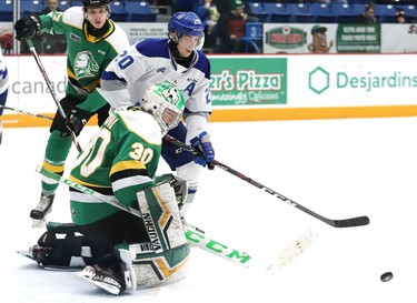 Shane Bulitka, of the Sudbury Wolves, looks for a rebound against Brett Brochu, of the London Knights, during OHL action at the Sudbury Community Arena in Sudbury, Ont. on Friday December 20, 2019. John Lappa/Sudbury Star/Postmedia Network