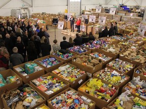 Dozens of people gathered Friday at the at the JMP Solutions for the final day of this year’s Business Cares Food Drive campaign, which supports the London Food Bank. (JONATHAN JUHA/The London Free Press)