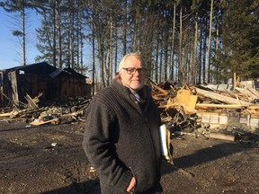 Mike Roberts, owner of Winter Wheat in Sparta, stands next to the wreckage of his business on Quaker Road. A Monday morning fire destroyed the business causing an estimated $400,000 in damage. (Laura Broadley/Times-Journal)