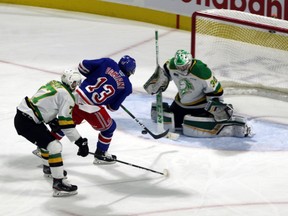 Kitchener Rangers player Riley Damiani slips his second goal past London Knights goalie Brett Brochu in London, Ont. on Saturday December 28, 2019. The Rangers beat London 7-2. Greg Colgan/Postmedia Network