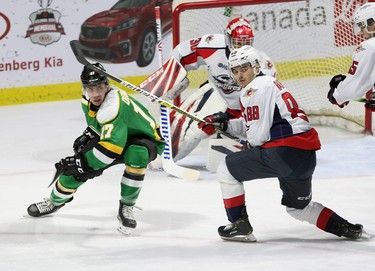 Windsor, Ontario Dec. 15, 2019.  London Knights Nathan Dunkley looks for a scoring chance against Spitfires Ruben Rufkin at WFCU Centre in Windsor Sunday. (NICK BRANCACCIO/Windsor Star)