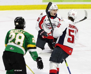 Windsor, Ontario Dec. 15, 2019.  Windsor Spitfires Egor Afanasyev, centre, celegrates his first period goal with teammate Wyatt Johnston against London Knights Ryan Merkley at WFCU Centre in Windsor Sunday. (NICK BRANCACCIO/Windsor Star)