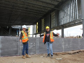 Ward 1 Coun. Michael van Holst and Ward 2 Coun. Shawn Lewis show off the construction at the East London Community Centre on December 5, 2019. (MEGAN STACEY/The London Free Press file photo)