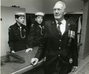 Veteran Art Powell at a dinner celebrating the Battle of the Atlantic held at London's Dufferin Hall; looking on is Sea Cadet Tom Griffin, 12 and Terry Slemin, 13, 1990. (London Free Press files)