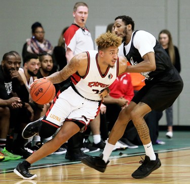 Windsor Express's Mike Baez, left, is guarded by London Lightning's Marcus Capers in the second half of a National Basketball League of Canada exhibition game at St. Clair College's Chatham Campus HealthPlex in Chatham, Ont., on Saturday, Dec. 14, 2019. Mark Malone/Chatham Daily News/Postmedia Network