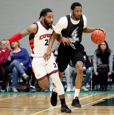 London Lightning's Marcus Capers, right, tries to get away from Windsor Express's DeShaun Thrower (2) in the second half of a National Basketball League of Canada exhibition game at St. Clair College's Chatham Campus HealthPlex in Chatham, Ont., on Saturday, Dec. 14, 2019. Mark Malone/Chatham Daily News/Postmedia Network