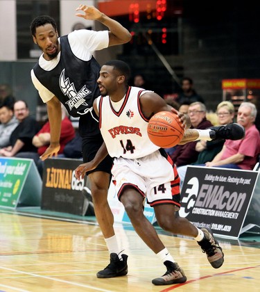 Windsor Express's Jody Hill (14) is guarded by London Lightning's Marcus Capers in the second half of a National Basketball League of Canada exhibition game at St. Clair College's Chatham Campus HealthPlex in Chatham, Ont., on Saturday, Dec. 14, 2019. Mark Malone/Chatham Daily News/Postmedia Network