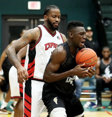 London Lightning's Otas Iyekekpolor, right, juggles a pass while being defended by Windsor Express's Sam Muldrow in the second half of a National Basketball League of Canada exhibition game at St. Clair College's Chatham Campus HealthPlex in Chatham, Ont., on Saturday, Dec. 14, 2019. Mark Malone/Chatham Daily News/Postmedia Network