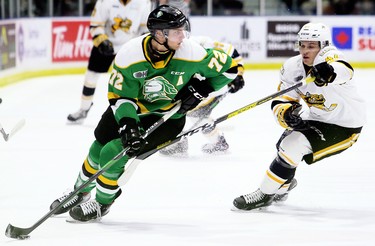 London Knights' Alec Regula (72) is chased by Sarnia Sting's Jacob Perreault (44) in the first period at Progressive Auto Sales Arena in Sarnia, Ont., on Sunday, Dec. 29, 2019. (Mark Malone/Postmedia Network)