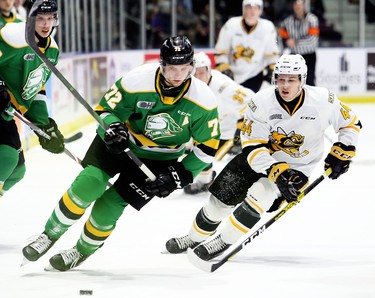 London Knights' Alec Regula (72) is chased by Sarnia Sting's Jacob Perreault (44) in the first period at Progressive Auto Sales Arena in Sarnia, Ont., on Sunday, Dec. 29, 2019. (Mark Malone/Postmedia Network)