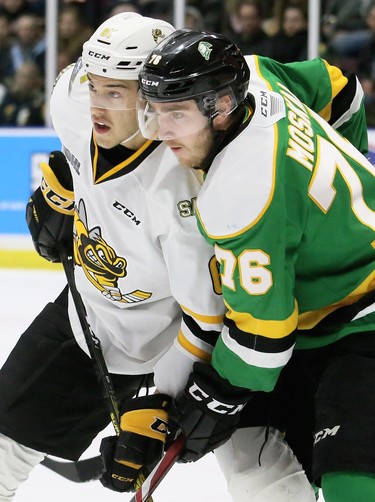 Sarnia Sting's Anthony Tabak (61) battles London Knights' Billy Moskal (76) in front of the Knights' net in the first period at Progressive Auto Sales Arena in Sarnia, Ont., on Sunday, Dec. 29, 2019. (Mark Malone/Postmedia Network)
