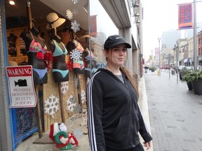 Carley Gallaway, manager at Bikini Paradise, misses having bus traffic on Dundas Street, but hopes that storefronts on the south side of the newly opened Dundas Place in downtown London will soon fill up. (Jane Sims/The London Free Press)