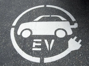 SIgnage for an electric vehicle-only parking spot.