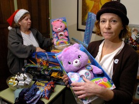 Jacqueline Thompson, director of the non-profit LifeSpin, holds one of the toys given to their Christmas donation program for needy families in this Free Press file photo.