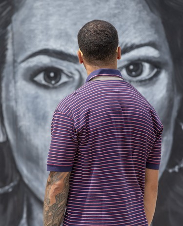The eyes of singer Sarah McLachlan look back at Preston Haynes of London as he admires a gallery of chalk drawings  at The London Rib Fest and Craft Beer Festival in Victoria Park in London on Monday August 5, 2019. (Derek Ruttan/The London Free Press)