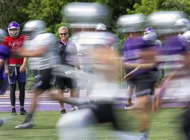 Head coach Greg Marshall puts players through their paces during Western Mustangs football practice at TD Stadium in London on Thursday August 22, 2019. (Derek Ruttan/The London Free Press)