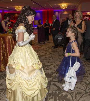 Beth Durno, 9, chats with a woman (who declined to reveal her true identity, dressed Belle, the star of Walt Disney's animated film, Beauty and the Beast, at the Children's Magical Winter Ball at RBC Place  in London, Ont. on Friday Dec. 6, 2019. The event, billed as London's only family friendly black tie event, raised money for the Children's Health Foundation. All proceeds will support the child life program the Children's Hospital of Western Ontario. Derek Ruttan/The London Free Press