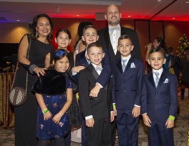 Michelle and Martin Kamil with their three children Selena, 6, Stella, 10, and Sebastien, 8, and their three nephews, the Cifelli brothers Dante, 10, Lucca, 8, and Alessio, 5,  attend the Children's Magical Winter Ball at RBC Place  in London, Ont. on Friday Dec. 6, 2019. The event, billed as London's only family friendly black tie event, raised money for the Children's Health Foundation. All proceeds will support the child life program the Children's Hospital of Western Ontario. Derek Ruttan/The London Free Pressk