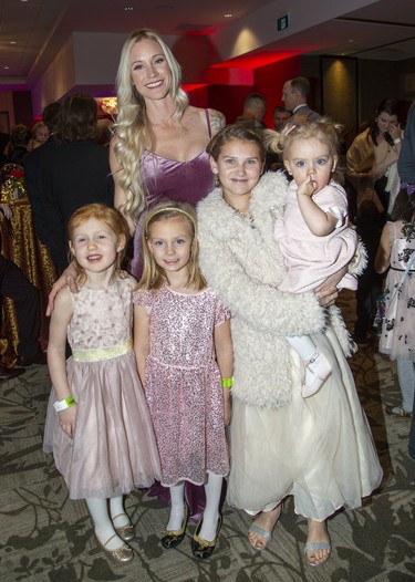 Brenleigh Knutson is with Charlotte Whitfield, left, Morrissey Hancock, Reese Van Rybroeck  and Goldie Hancock at the Children's Magical Winter Ball at RBC Place  in London, Ont. on Friday Dec. 6, 2019. The event, billed as London's only family friendly black tie event, raised money for the Children's Health Foundation. All proceeds will support the child life program the Children's Hospital of Western Ontario. Derek Ruttan/The London Free Press