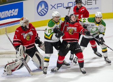London Knights Nathan Dunkley (17) and Jonathan Gruden (44) tussle with Owen Sound Attack defenders Andrew Perrott and Igor Chibrikov in front Attack goalie Mack Guzda in the first period of their game at Budweiser Gardens in London, Ont. on Saturday December 7, 2019. Derek Ruttan/The London Free Press/Postmedia Network
