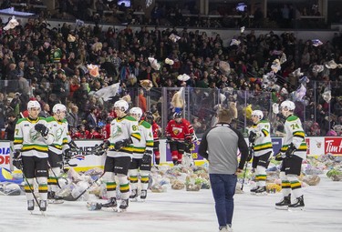 Stuffed animals rain down on the ice surface at Budweiser Gardens during the second period of an OHL hockey game between the London Knights and Owen Sound Attack in London, Ont. on Friday December 6, 2019. The annual Teddy Bear Toss provides thousands of toys for needy children that will be distributed by the Salvation Army. Derek Ruttan/The London Free Press/Postmedia Network