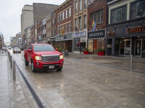Vehicles are now able to use the entire downtown length of Dundas Street after ward 13 councillor Arielle Kayabaga and mayor Ed Holder placed the final brick to complete construction of Dundas Place in downtown  London. More that 700,000 bricks and $16 million were used to transform Dundas Street between Wellington Street and Ridout Street  into a "flex street." (Derek Ruttan/The London Free Press)