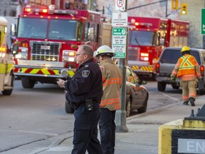 A person was rushed to hospital via ambulance after being run over by a car exiting a Citi Plaza parking garage on Clarence Avenue in London, Ont. on Wednesday December 11, 2019. Derek Ruttan/The London Free Press/Postmedia Network