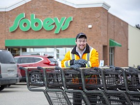 Matthew MacNeil  is working with digital giant Google to improve its voice-recognition system for people with Down syndrome so they can better access the search engine. Photo shot at Sobeys in Tillsonburg, Ont. where he has worked for 17 years. (Derek Ruttan/The London Free Press)