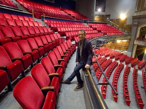 Artistic director Dennis Garnhum sits among empty seats in the balcony of London's Grand Theatre, which has cancelled the balance of its season in the face of the COVID-19 pandemic. (Files)