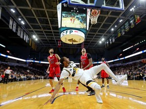 The London Lightning's Marcus Capers is fouled by Windsor's Ty Walker but makes the hoop during their final game of the season at Budweiser Gardens in London. Photograph taken on Sunday March 31, 2019. Says photographer Mike Hensen:
Marcus Capers is fun to shoot, period. Often cited as the most athletic of an athletic group of London Lightning players, Capers plays all out. This shot has a lot of eyes all focused on the hoop, and it shows a bit of the crowd size at the Bud.