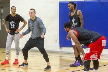 New Lightning head coach Doug Plum talks about positioning with Xavier Moon, Anthony AJ Gaines Jr. and Muhammad El-Amin. Plum, says this week is going to be a "grind for the guys," as they get up to speed during the first week of the London Lightning training camp  in London, Ont.  (Mike Hensen/The London Free Press)