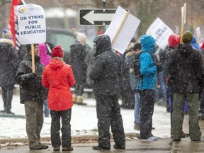 Teachers and support workers from Central Secondary, Beal and other schools held a mass picket on Dufferin Street.  (Mike Hensen/The London Free Press)