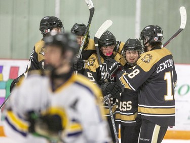 The Holy Cross Centurions celebrate a goal by Dylan Demeulenaere putting them up 2-0 over the St. Joe's Ramsduring their game on Wednesday at Joe Thornton Arena in St. Thomas. (Mike Hensen/The London Free Press)