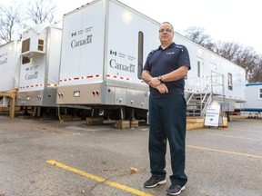 Albert Guite, site manager for Statistics Canada's mobile medical clinic, stands outside the trailers that make up the facility parked by Storybook Gardens in London, Ont.  Photograph taken on Friday December 6, 2019.