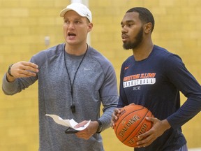 London Lightning head coach Doug Plumb talks to newcomer guard Jaylon Tate who will be looking to fit into a team with several strong guards already in camp in London, Ont.  (Mike Hensen/The London Free Press)