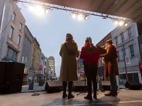 The Carols, made up of Marty Kolls, Lynne Craven and Natash Roberts, sing Christmas classics on London's Dundas Place flex street as the new sections between Richmond and Wellington streets were closed earlier this month for an event. (Free Press file photo)