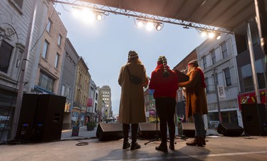 The Carols, made up of Marty Kolls, Lynne Craven and Natash Roberts, sing Christmas classics on London's Dundas Place flex street hoping for crowds as the new sections between Richmond and Wellington streets were closed Friday afternoon for a celebration. (
Mike Hensen/The London Free Press)