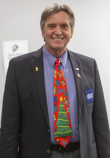 Ron DeLeeuw, an OHL timekeeper, didn't have an ugly sweater so he went with a tie at Ugly Sweater Night at the London Knights game against the Sarnia Sting at Budweiser Gardens in London on Friday. (Mike Hensen/The London Free Press)
