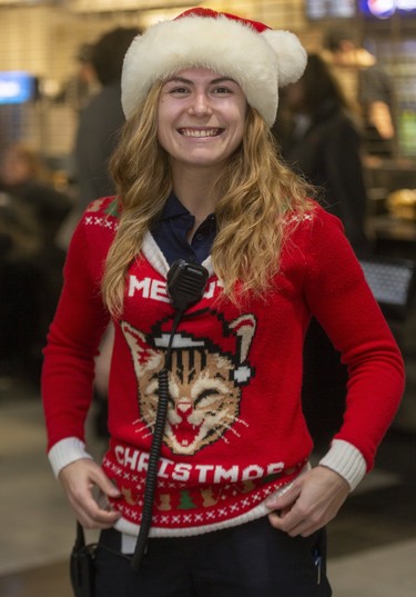 EMS worker Sammy Robb gets in the spirit at Ugly Sweater Night at the London Knights game against the Sarnia Sting at Budweiser Gardens in London on Friday. (Mike Hensen/The London Free Press)